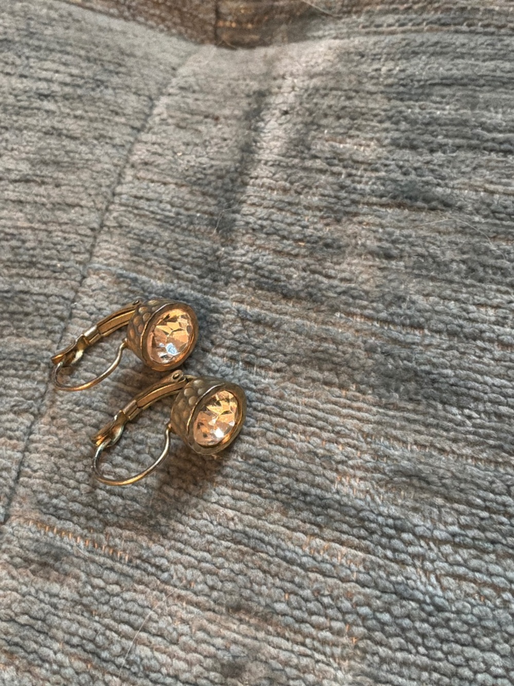 White crystal gold tone earrings